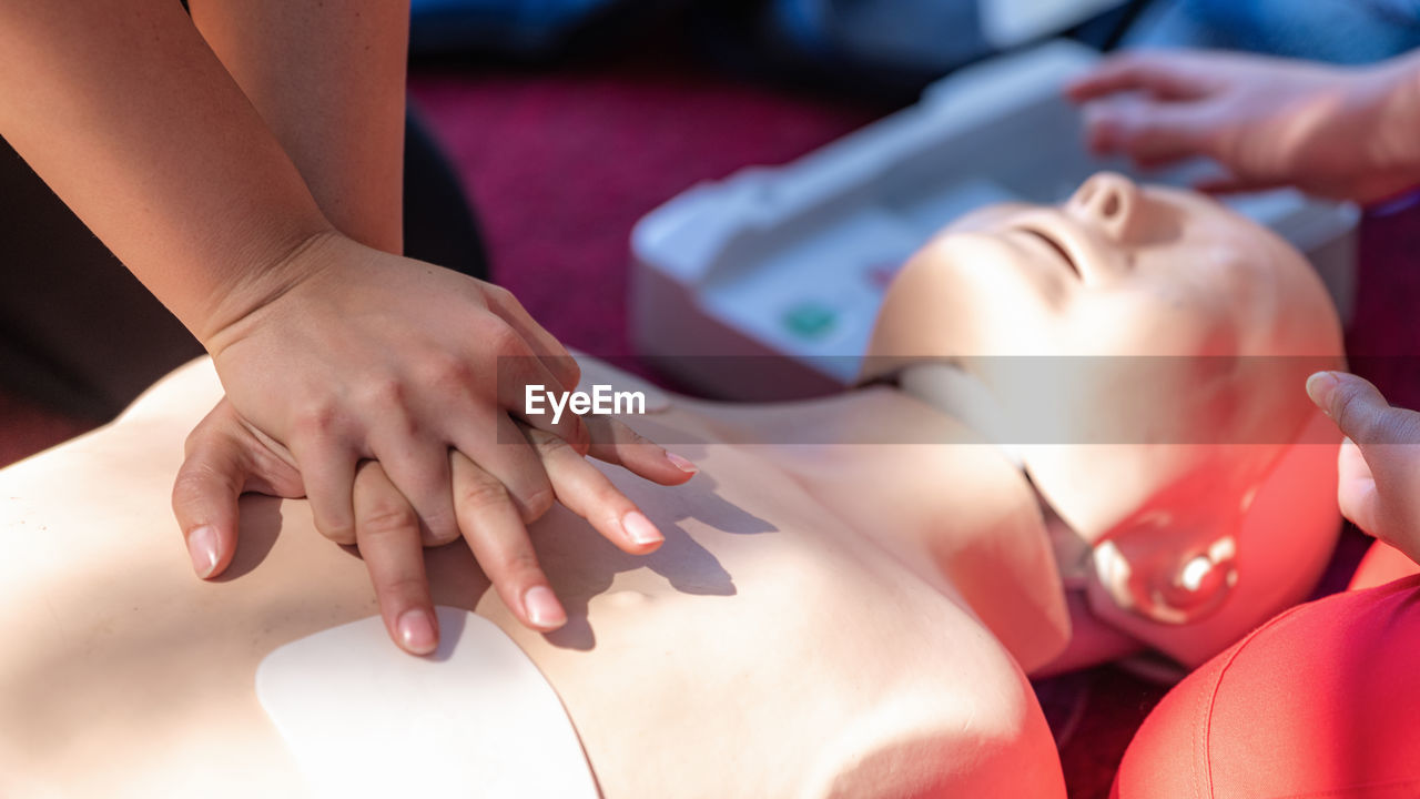 Cardiopulmonary resuscitation, first aid training on a cpr dummy.