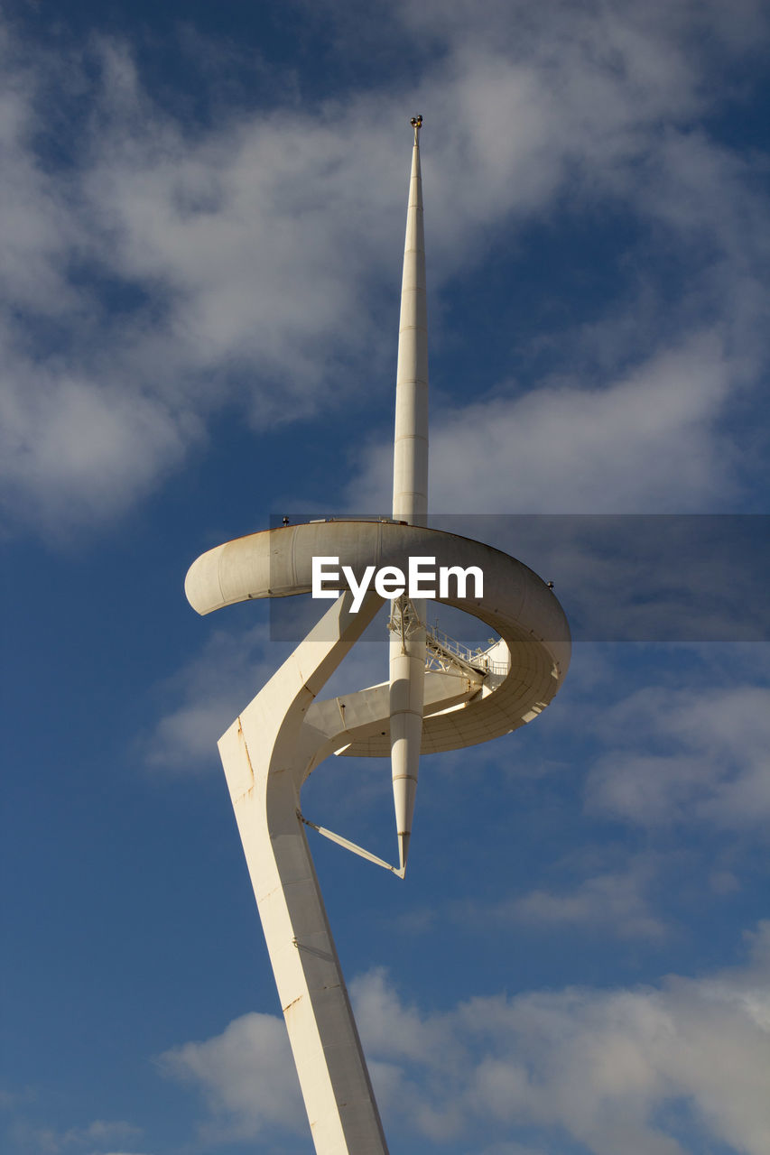 Low angle view of communication pole against sky