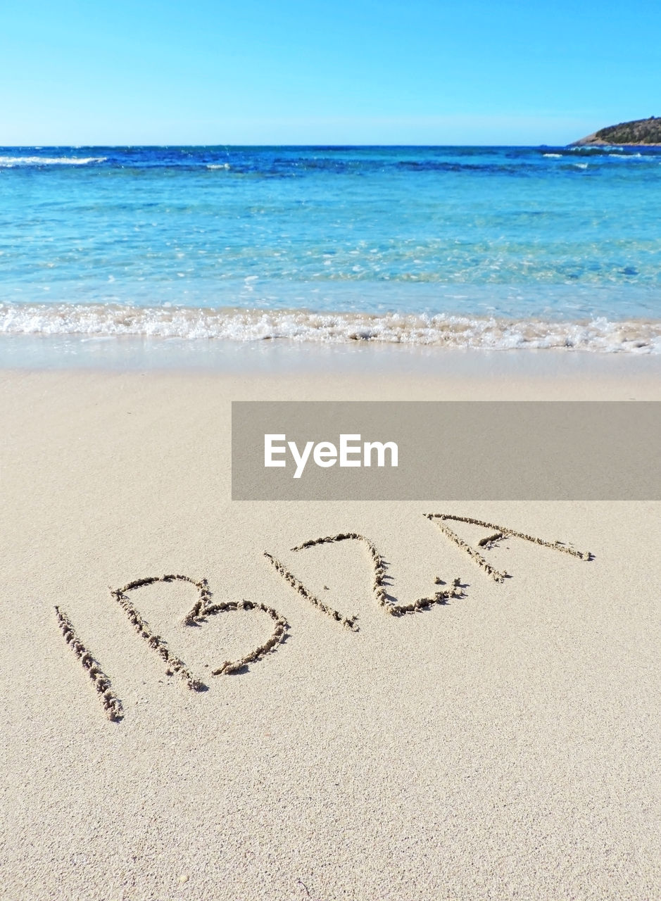 TEXT ON SAND AT BEACH