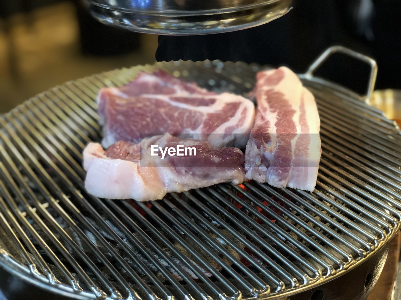 Close-up of meat on barbecue grill