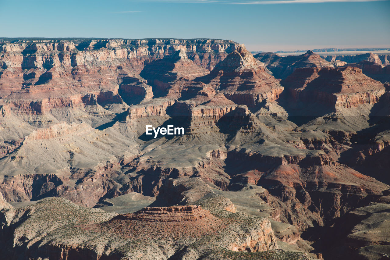 Scenic view of eroded landscape against sky