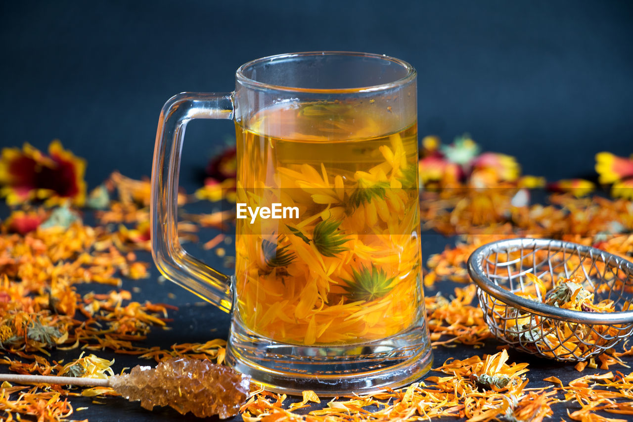 Close-up of flowers in cup on table