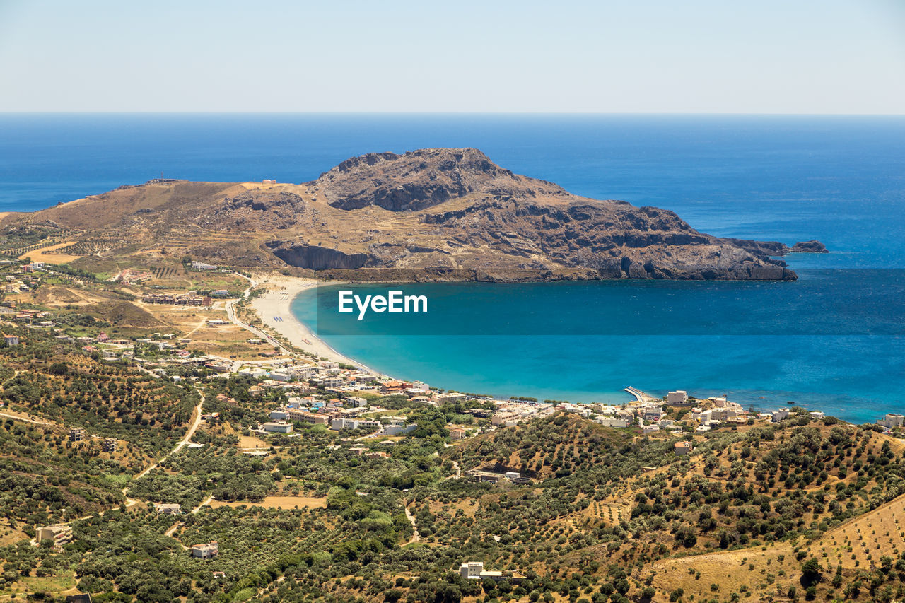 Scenic view of bay against clear sky