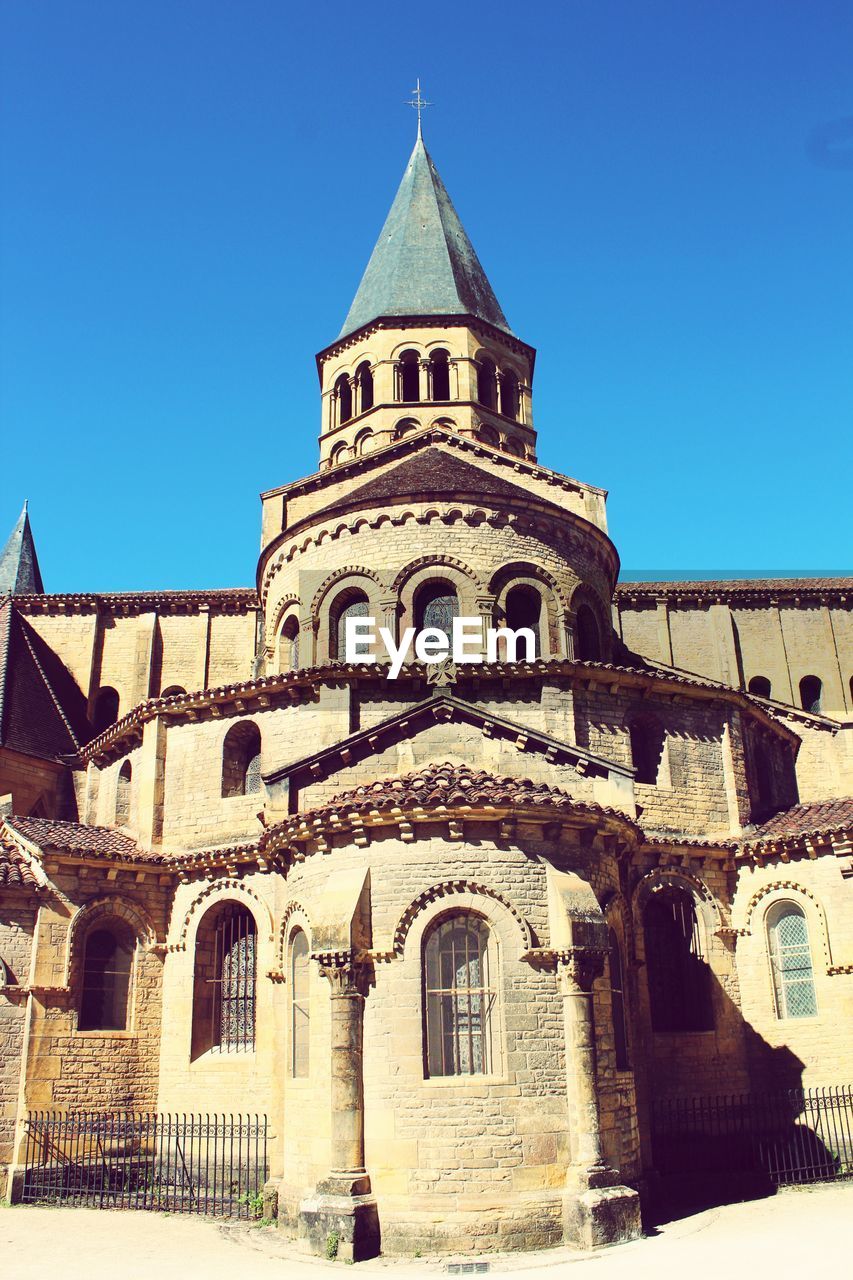 LOW ANGLE VIEW OF CHURCH AGAINST BLUE SKY