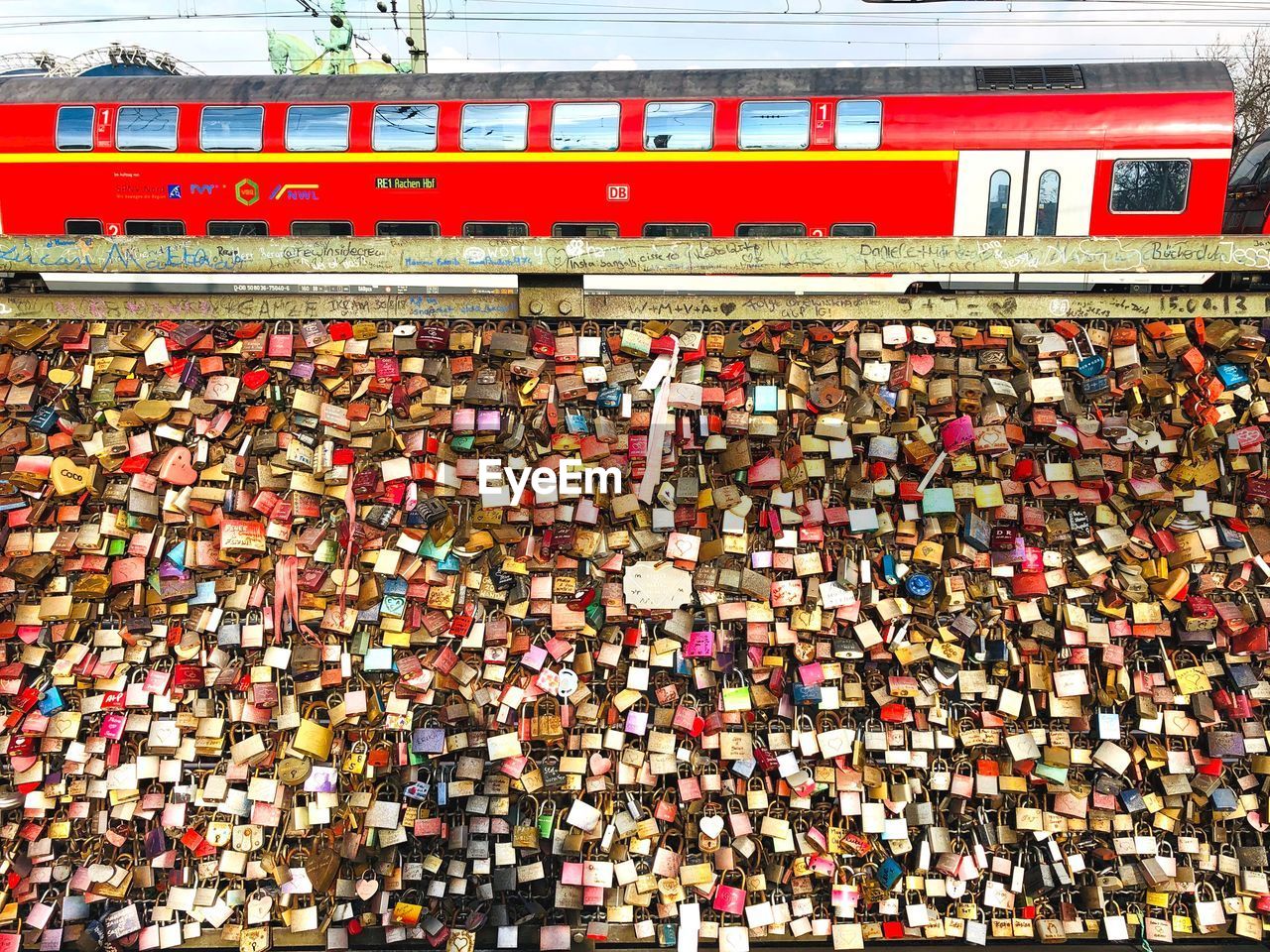 High angle view of love locks on railing in city