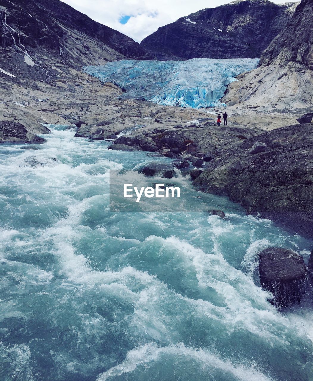 Scenic view of river flowing through rocks