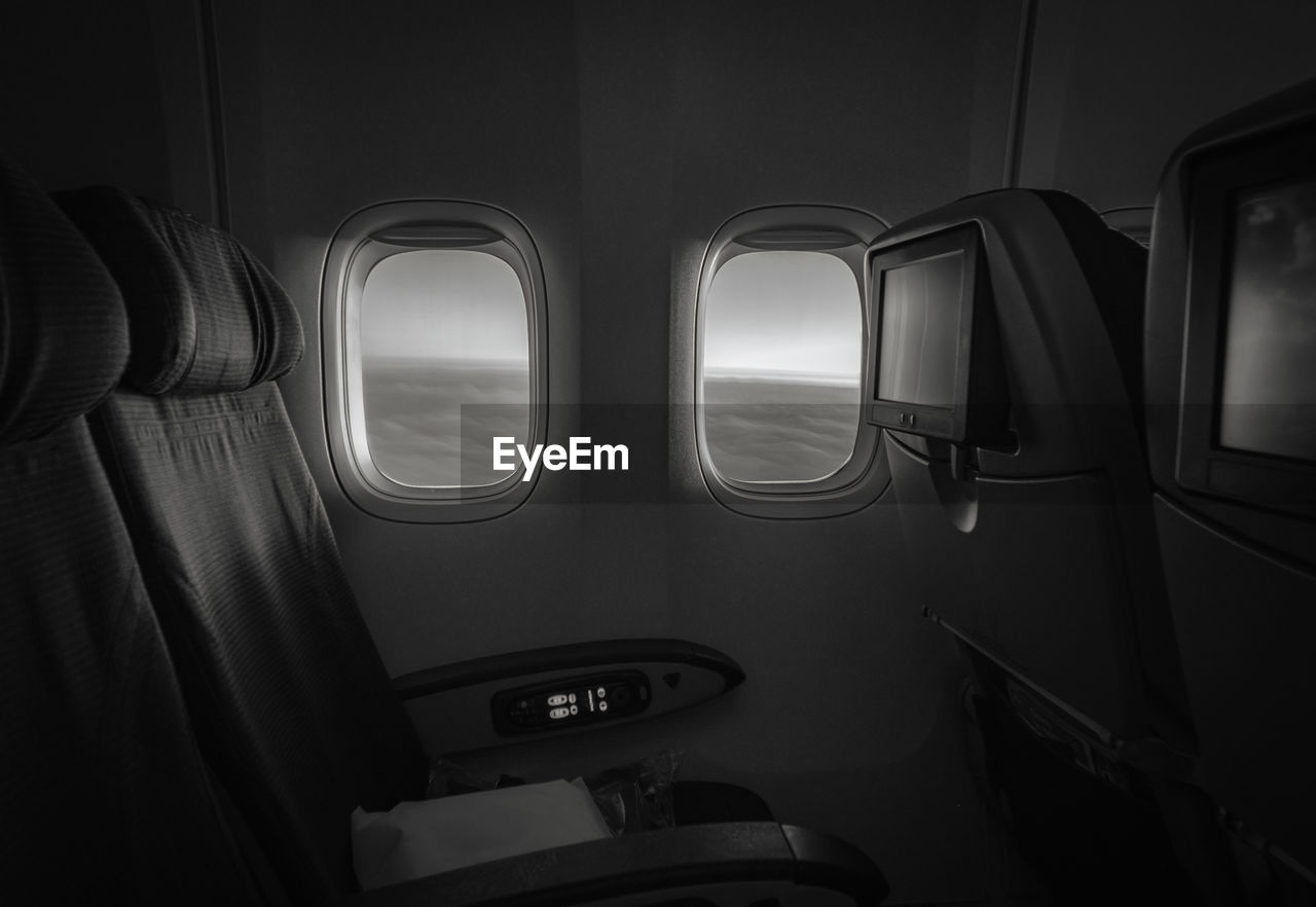 View of empty seat by window in airplane