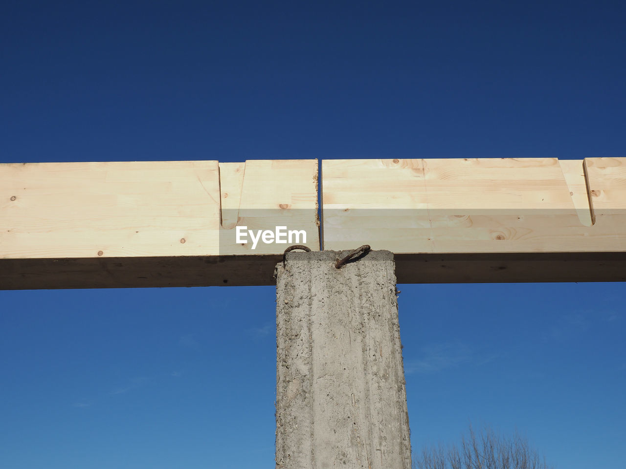 blue, sky, clear sky, wood, no people, low angle view, nature, architecture, day, built structure, outdoors, copy space, sunny, sign
