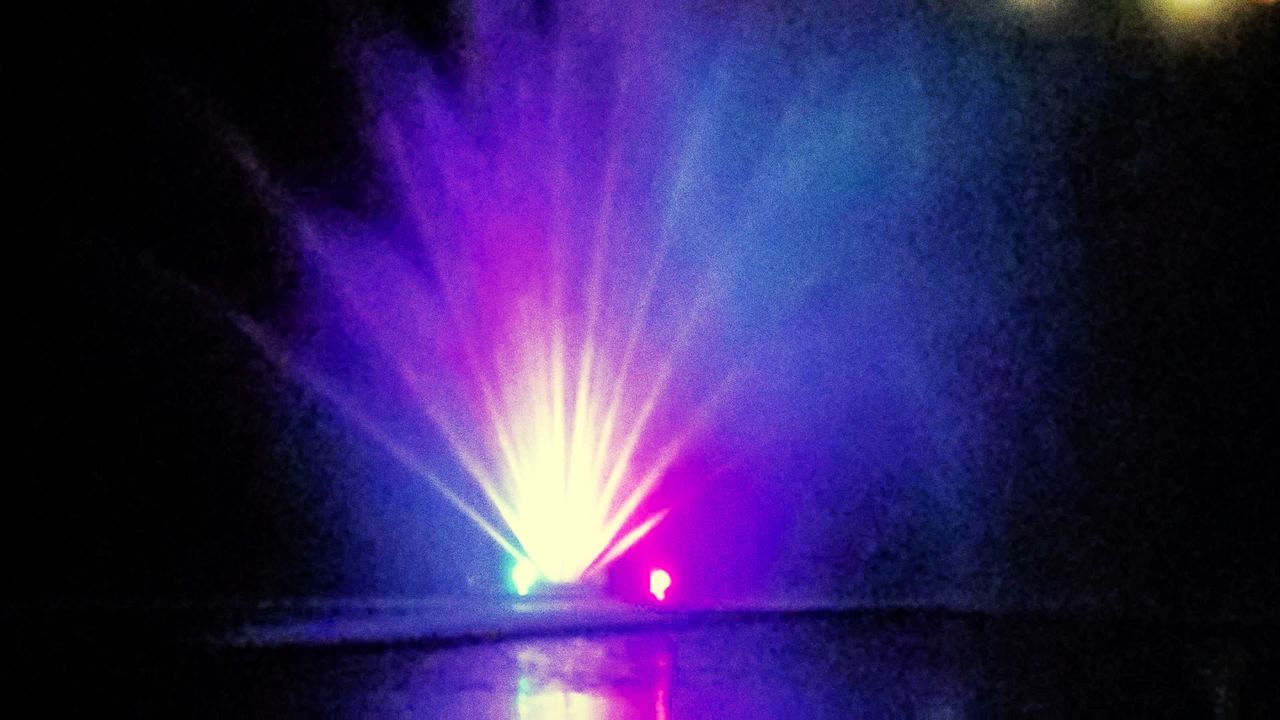 night, illuminated, light, arts culture and entertainment, lighting equipment, light - natural phenomenon, purple, blue, light beam, no people, darkness, glowing, performance, nightlife, lens flare, multi colored, water, event, motion, music, stage, nature, reflection, lighting
