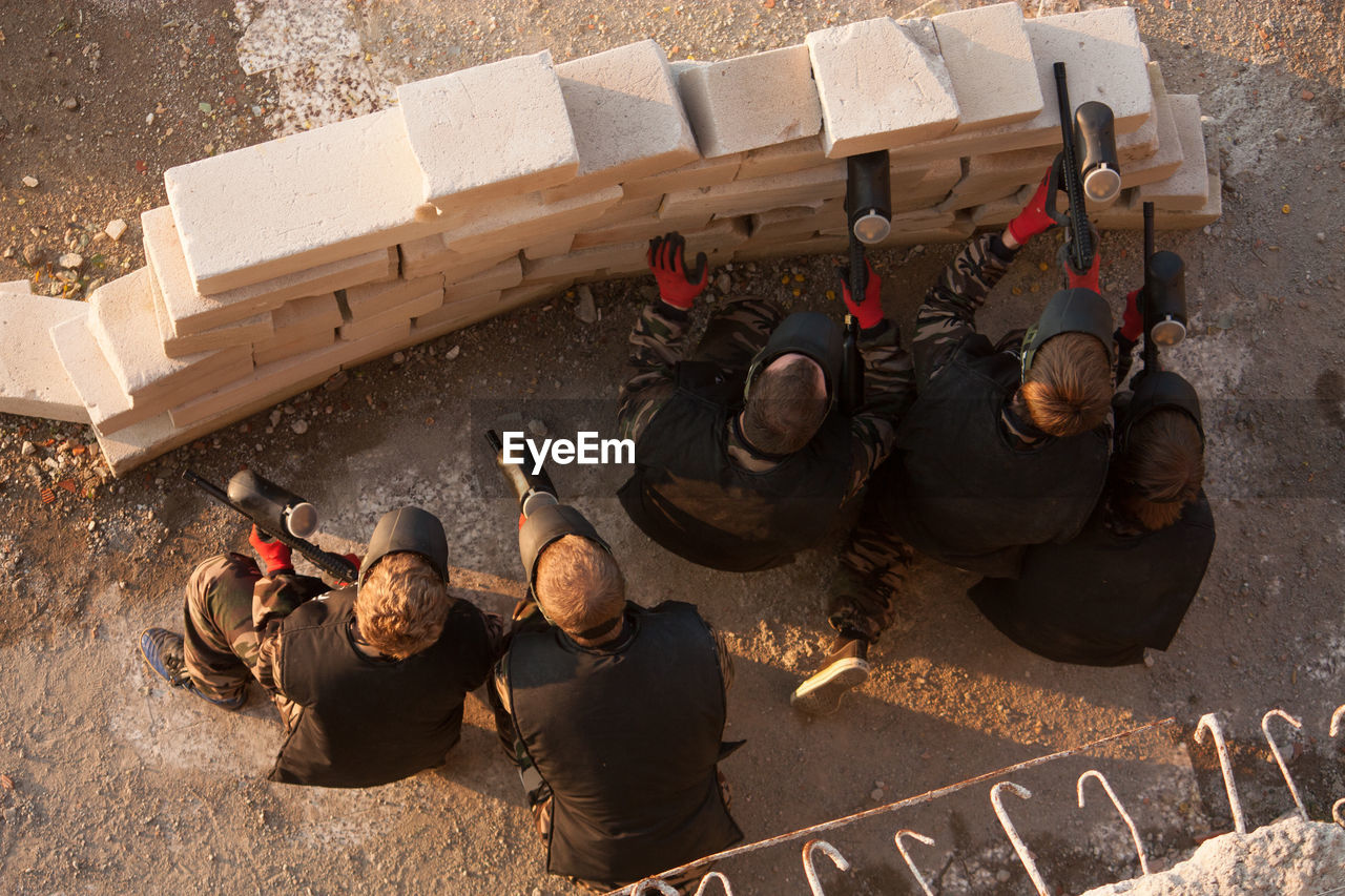 High angle view of paintball shooters in action