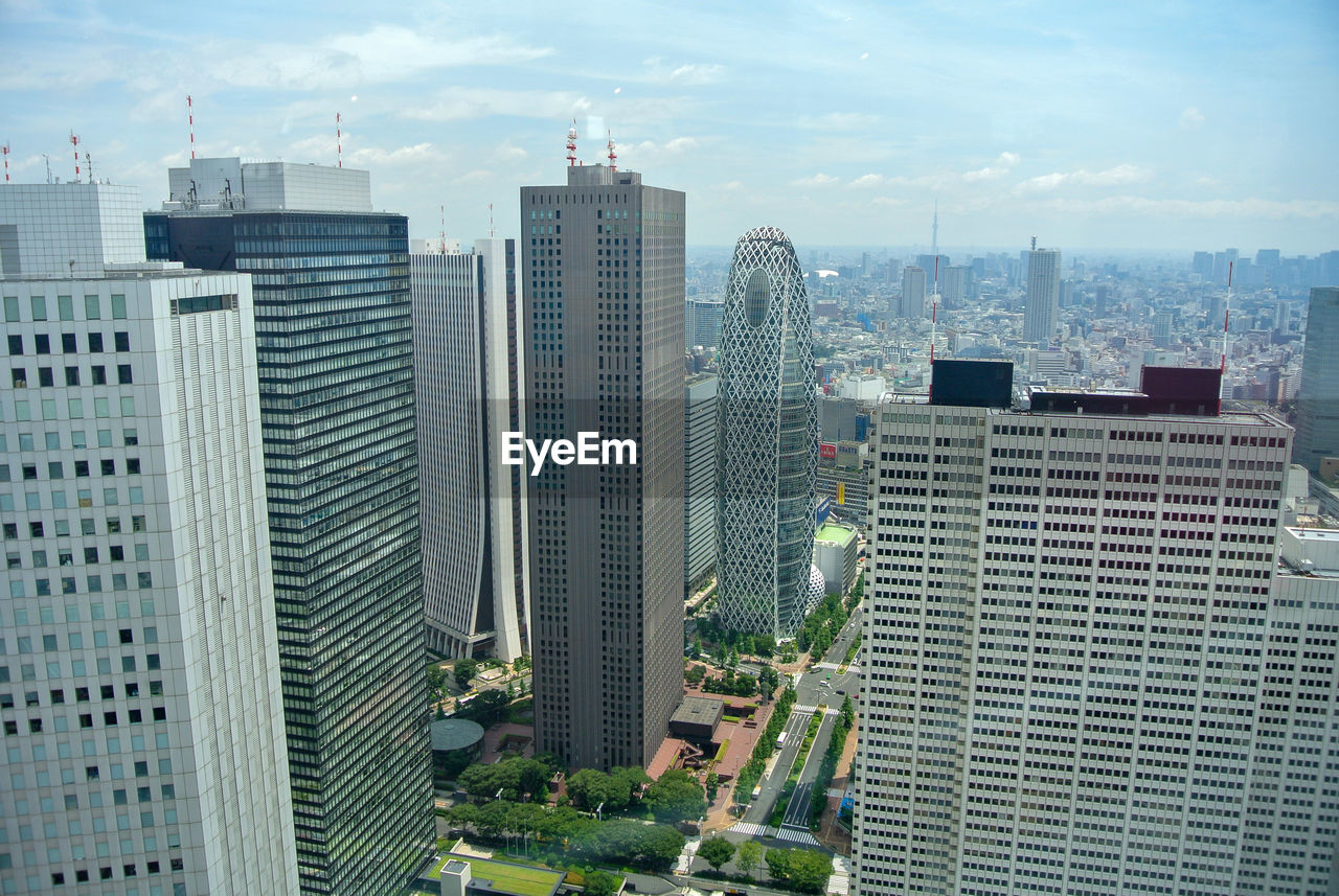 architecture, city, building exterior, built structure, building, metropolitan area, skyscraper, office building exterior, tower block, skyline, metropolis, landscape, sky, cityscape, urban area, urban skyline, downtown, residential district, office, downtown district, landmark, nature, tower, neighbourhood, no people, residential area, travel destinations, city life, high angle view, day, cloud, outdoors, business, condominium, financial district, travel, development, street
