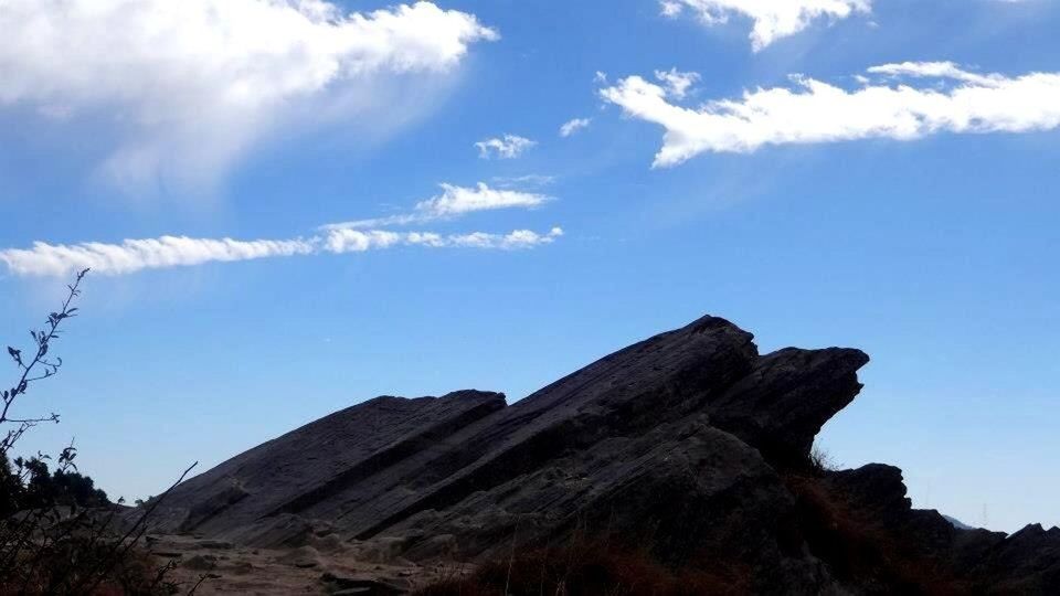 Low angle view of rock against sky