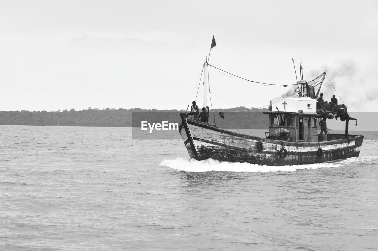 NAUTICAL VESSEL IN SEA AGAINST SKY