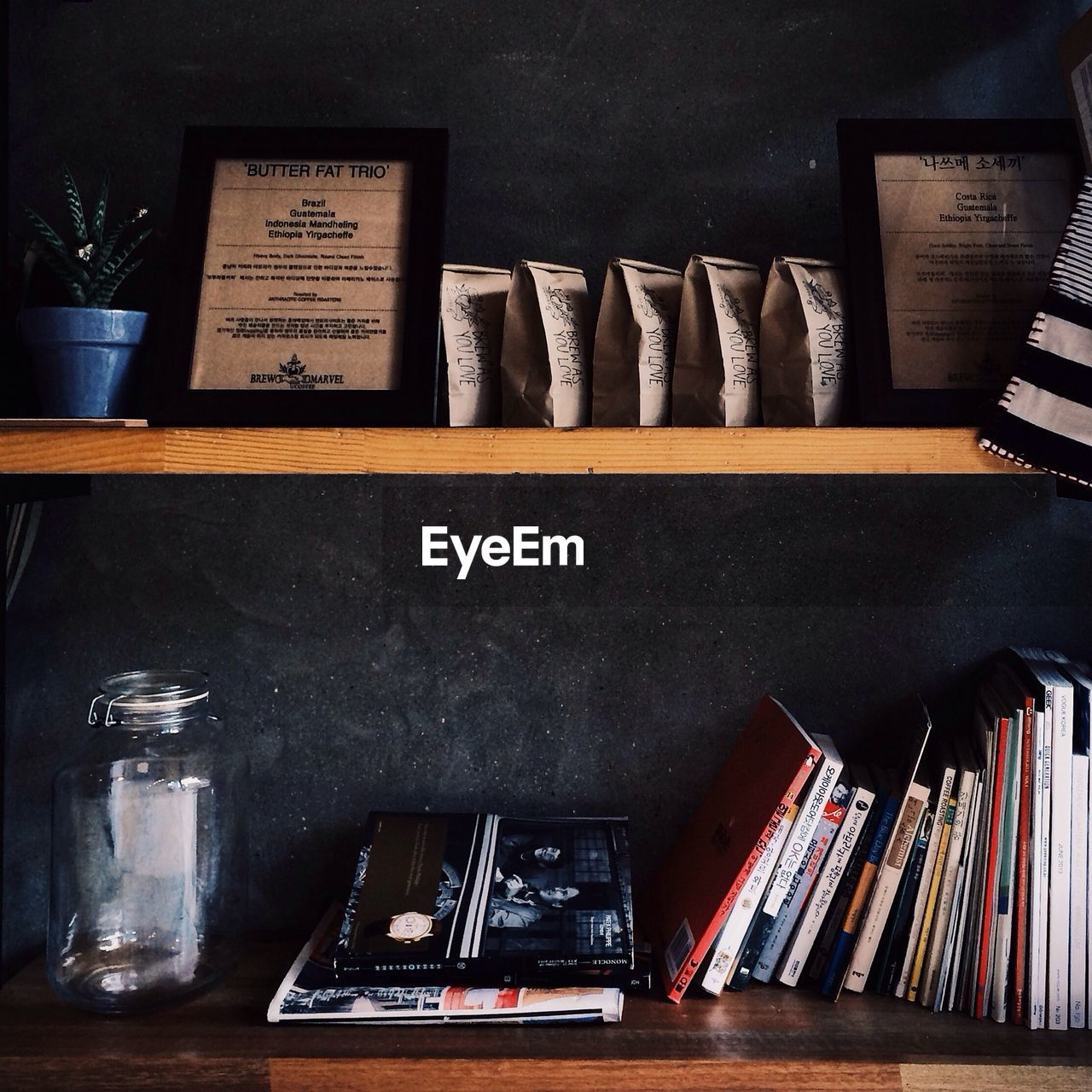 Books and packets arranged in shelf