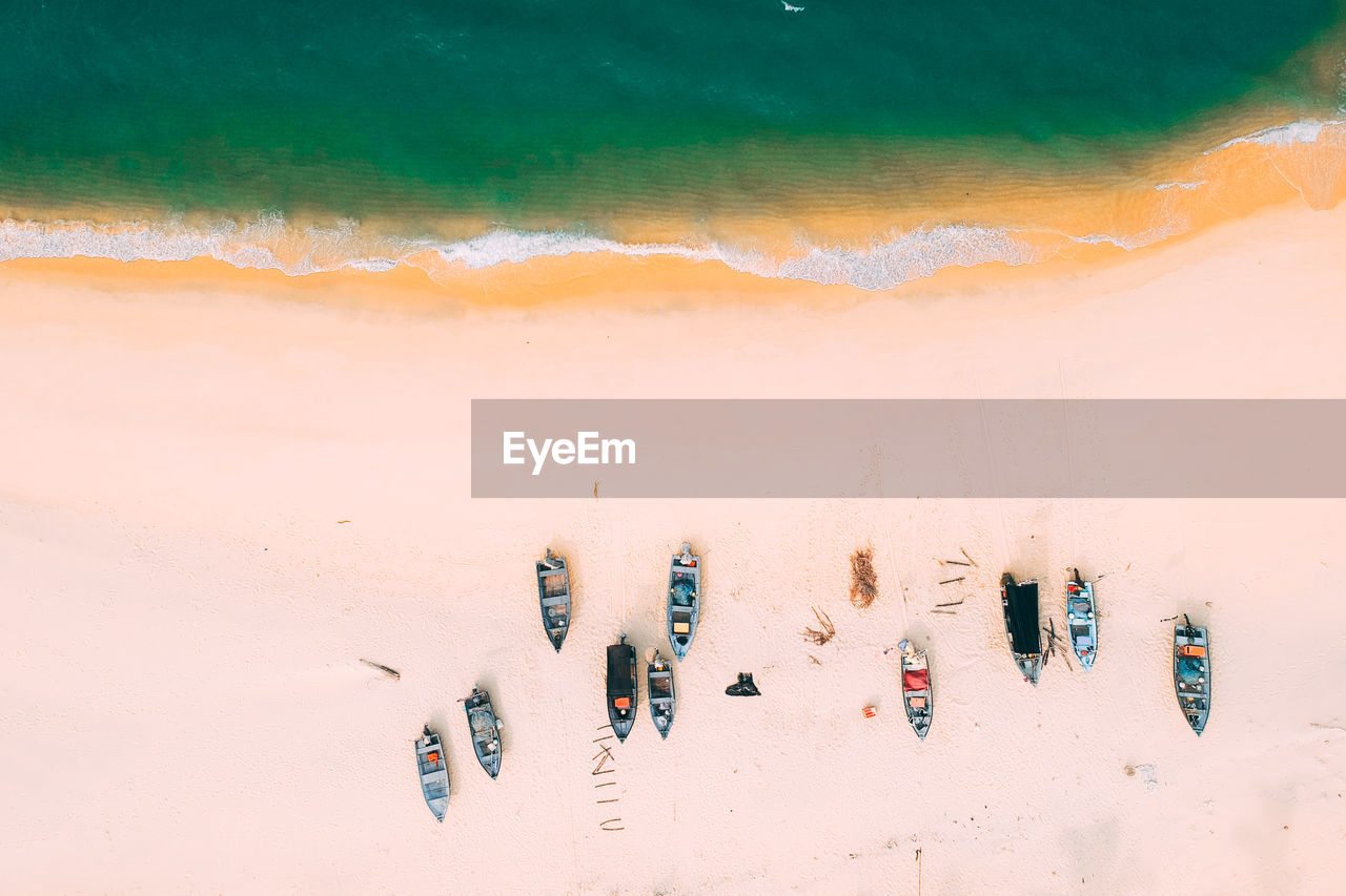 HIGH ANGLE VIEW OF SAND ON BEACH