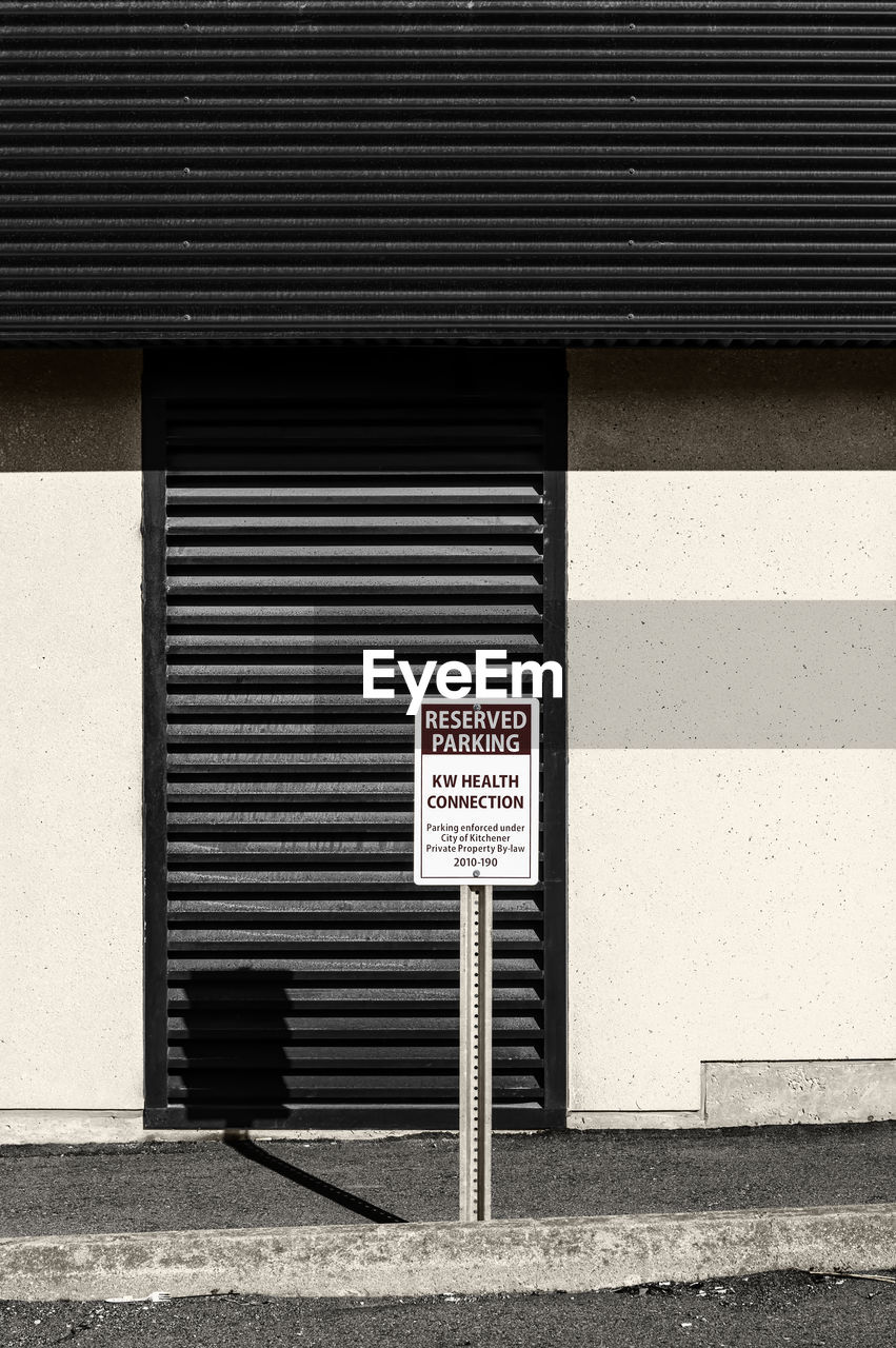 Reserved parking. a minimal photograph  of a reserved parking sign in a public parking lot.
