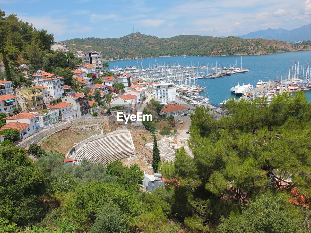 High angle view of buildings by sea against sky