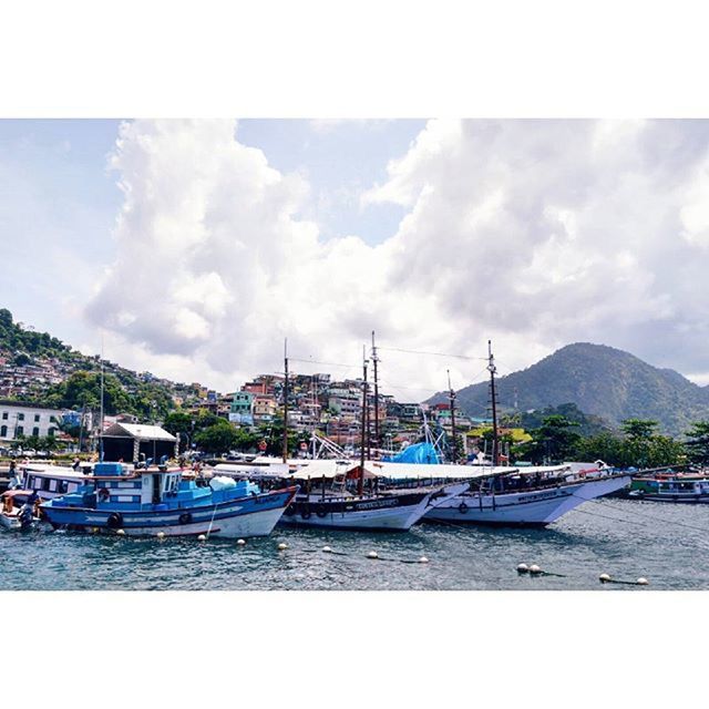 BOATS MOORED IN HARBOR