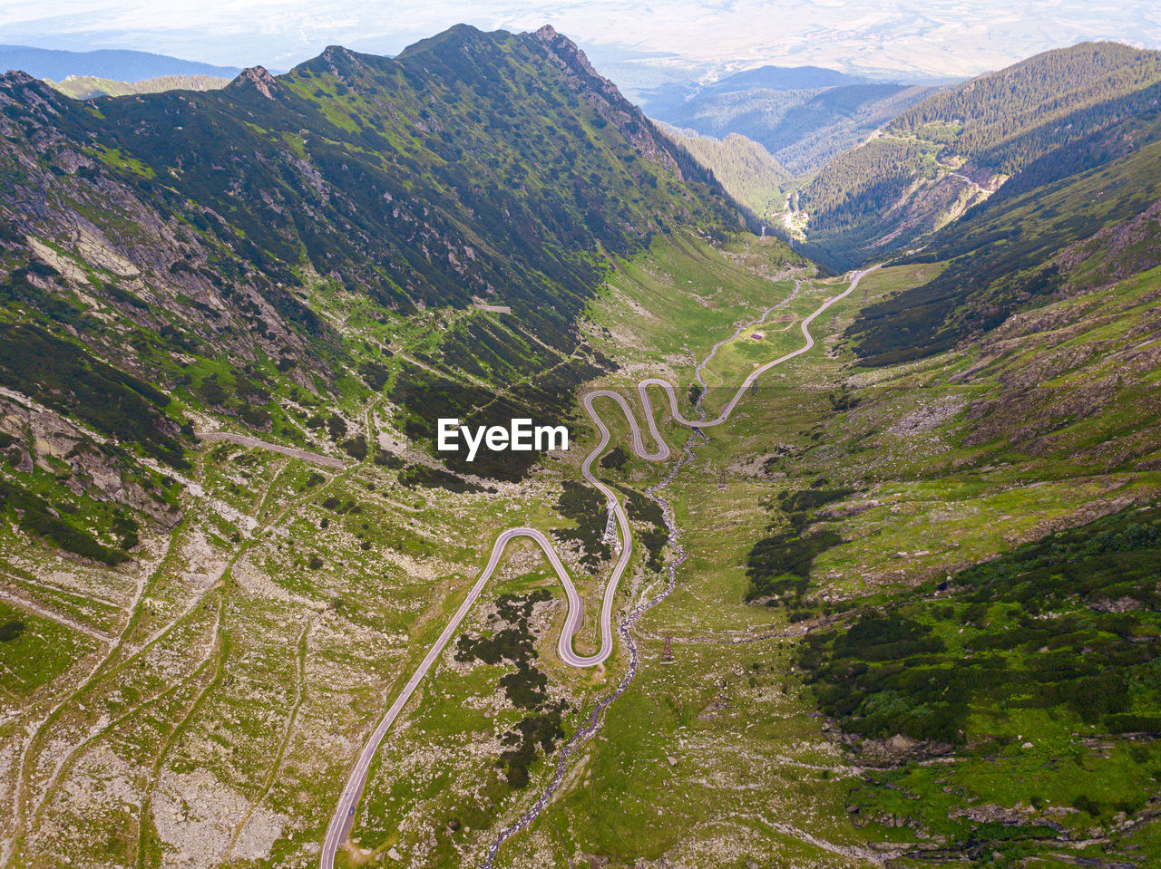 HIGH ANGLE VIEW OF ROAD ON MOUNTAIN