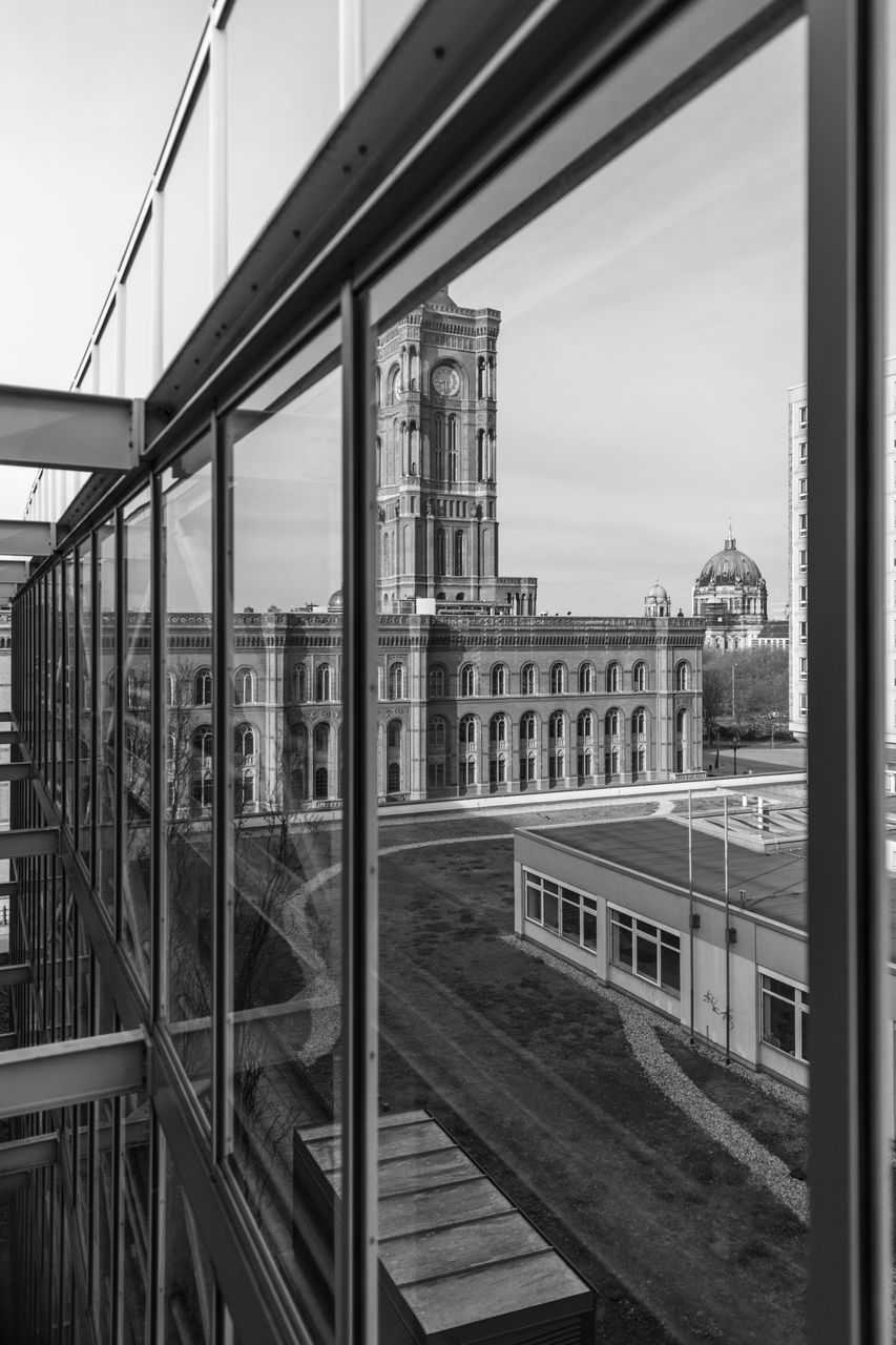 architecture, built structure, black and white, monochrome, monochrome photography, building exterior, city, sky, no people, iron, transport, bridge, urban area, transportation, rail transportation, day, nature, line, outdoors, white, railing, public transport, building, track, travel, railroad track, travel destinations