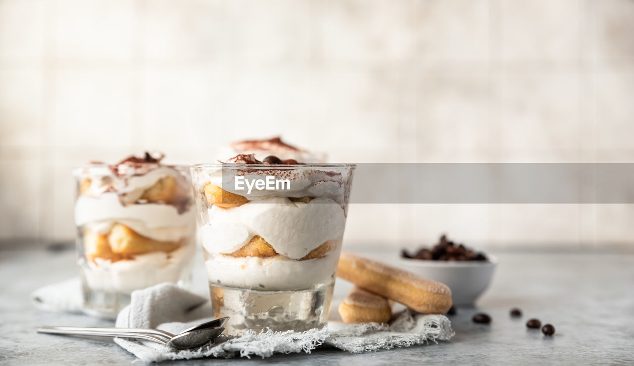 Traditional italian dessert tiramisu. coffee flavored dessert made of ladyfingers and mascarpone.