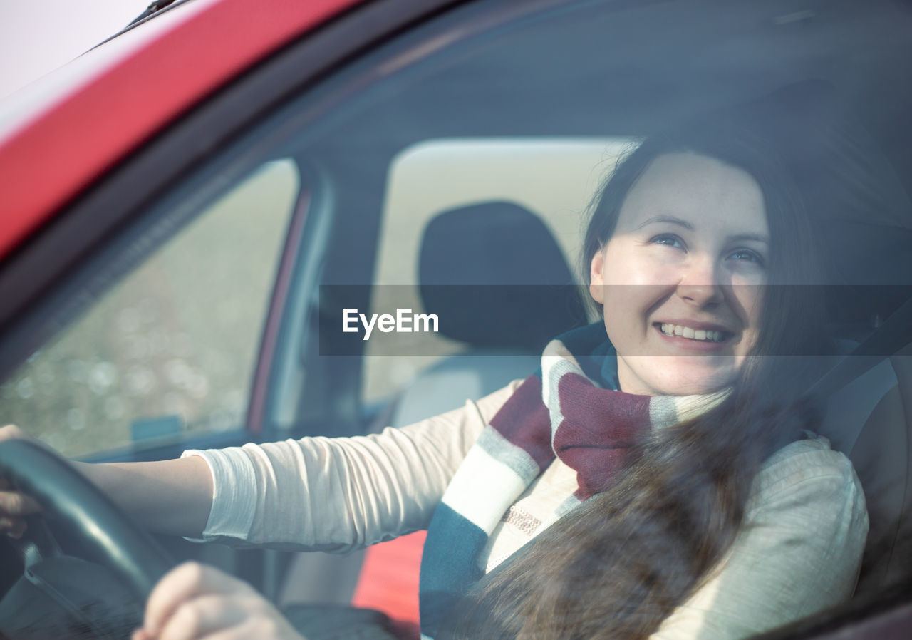 portrait of woman in car