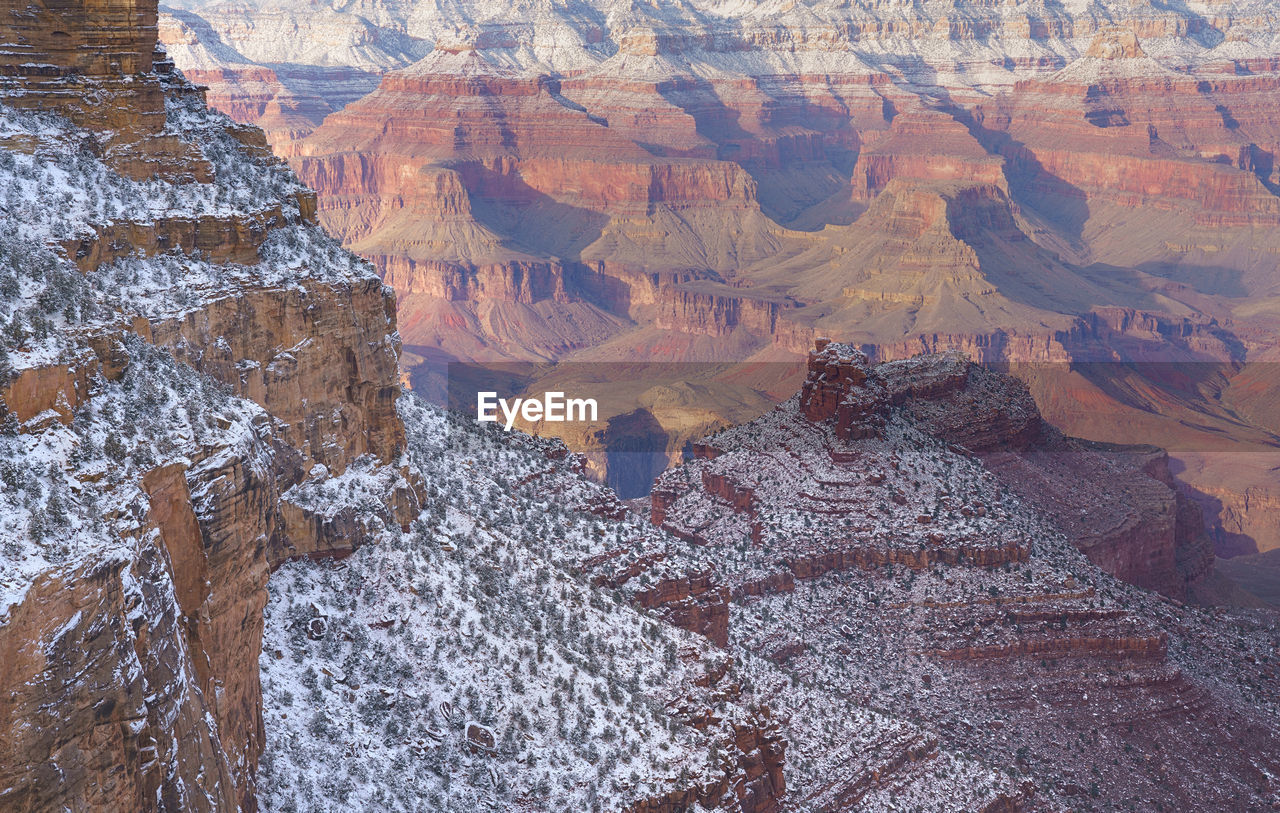 HIGH ANGLE VIEW OF ROCK FORMATIONS AT WATER