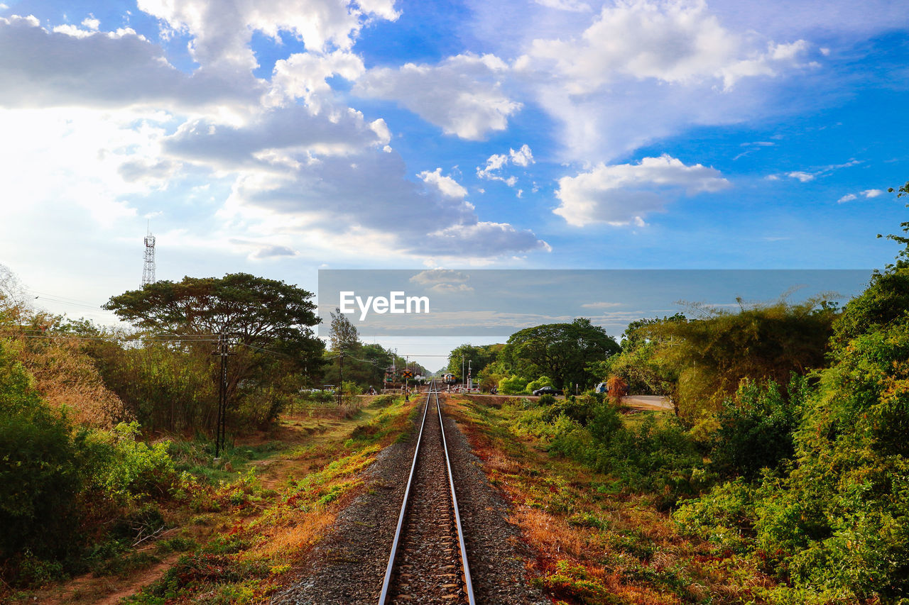 VIEW OF RAILROAD TRACK AGAINST SKY