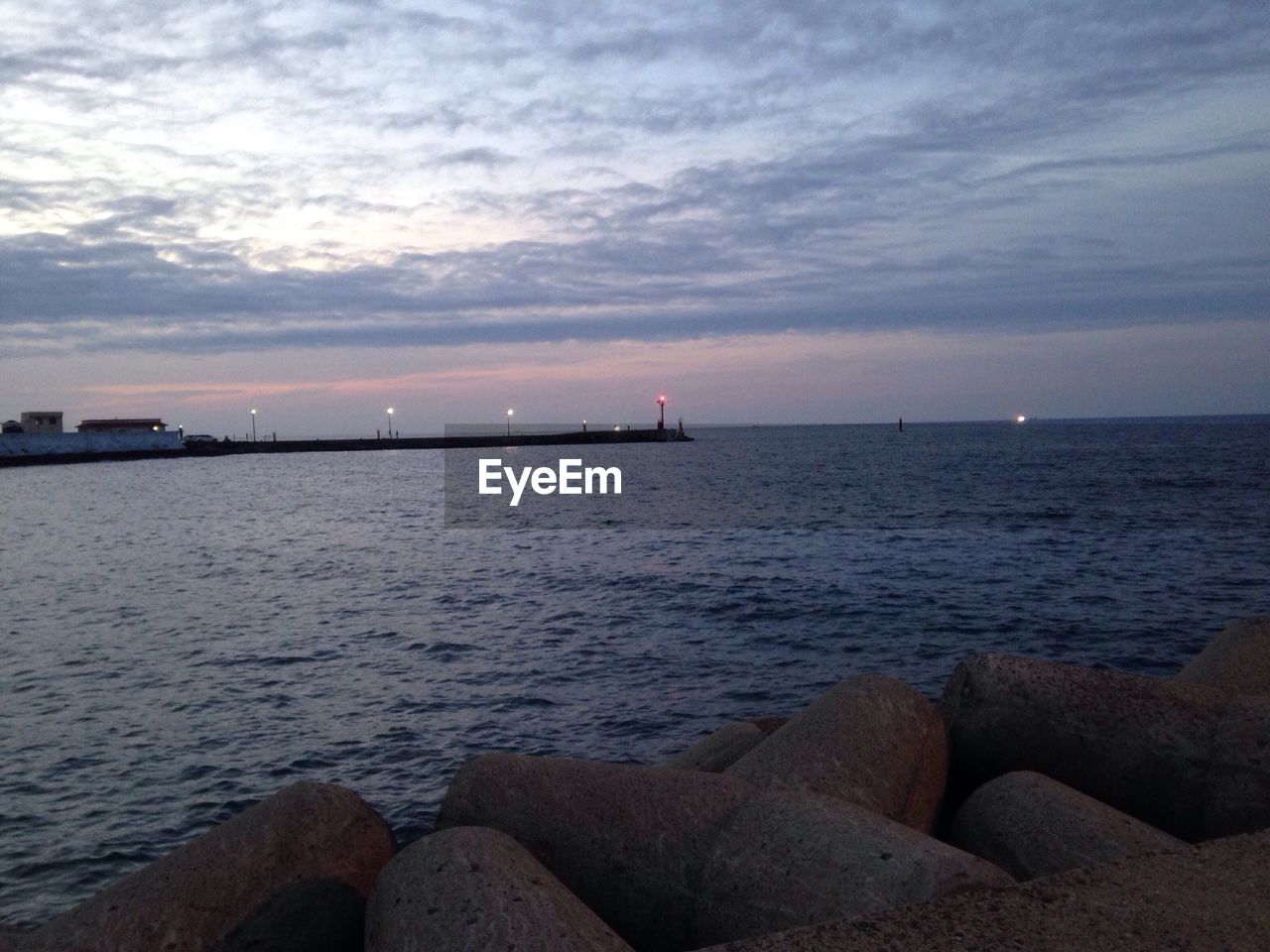 VIEW OF SEA AGAINST CLOUDY SKY