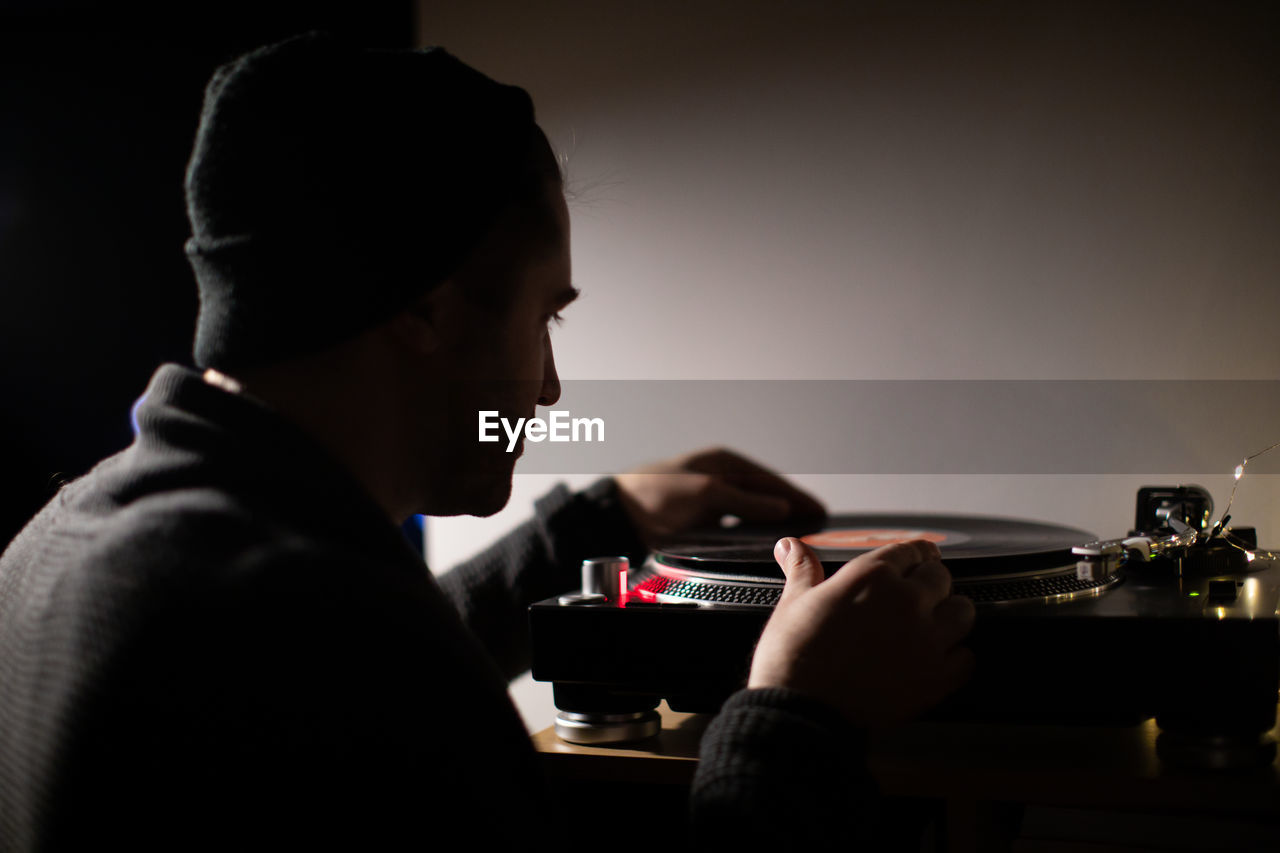 Man playing turntable