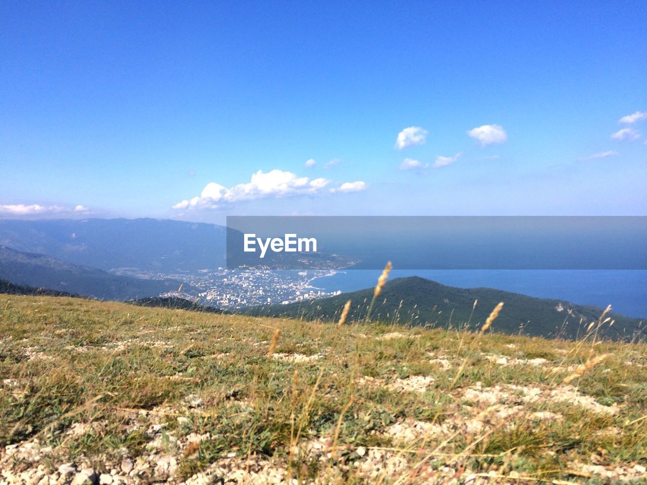 Scenic view of landscape and sea against sky