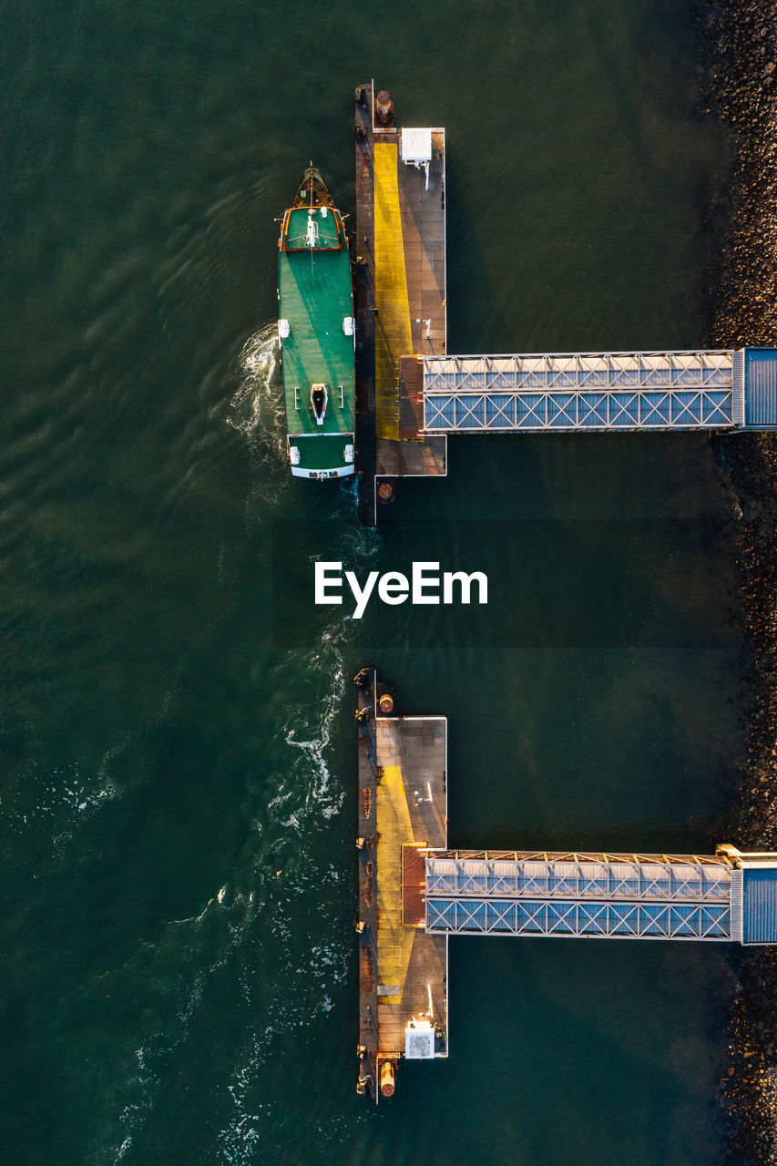 High angle view of boat and metal structure in river