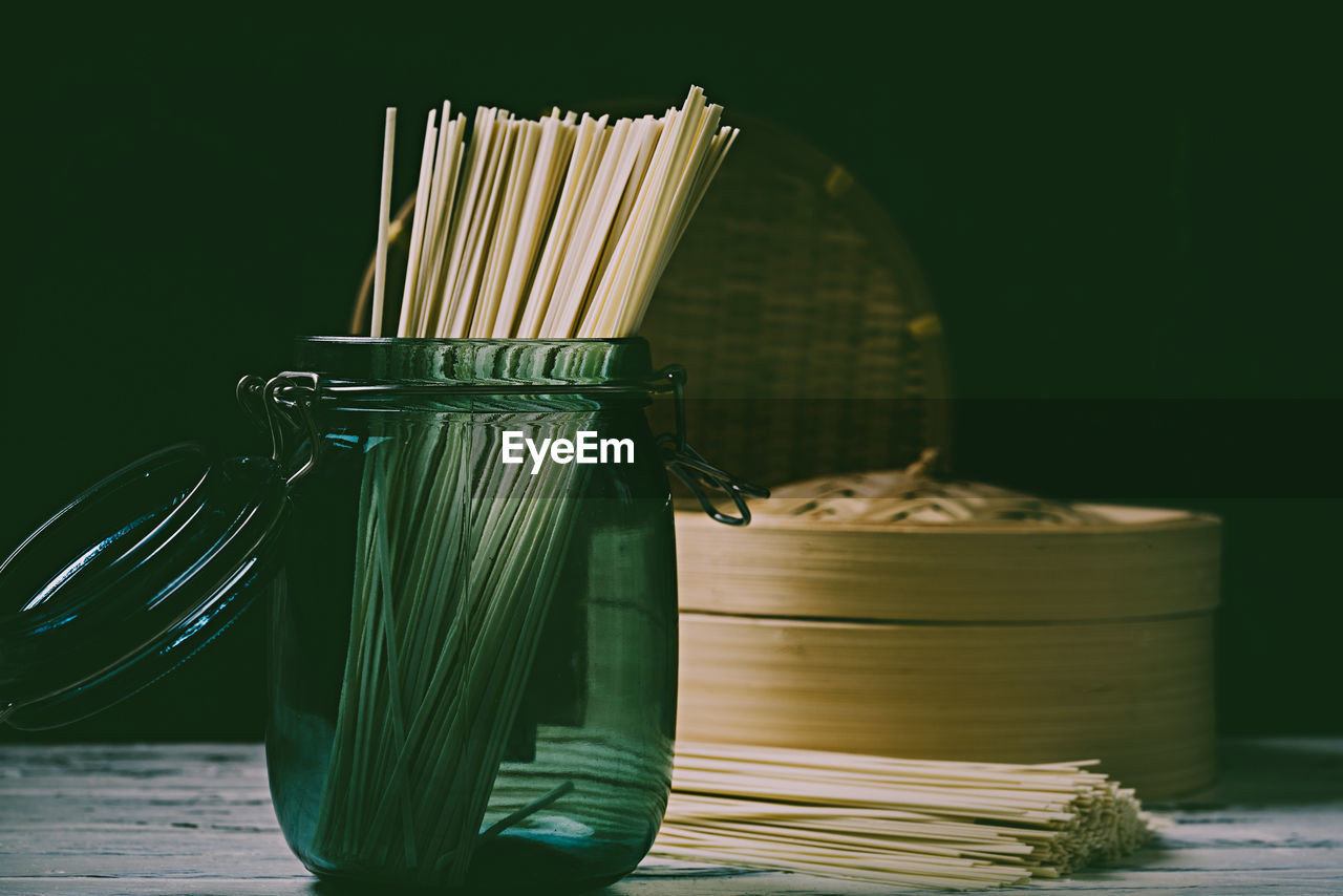 CLOSE-UP OF BREAD ON TABLE AGAINST WHITE BACKGROUND