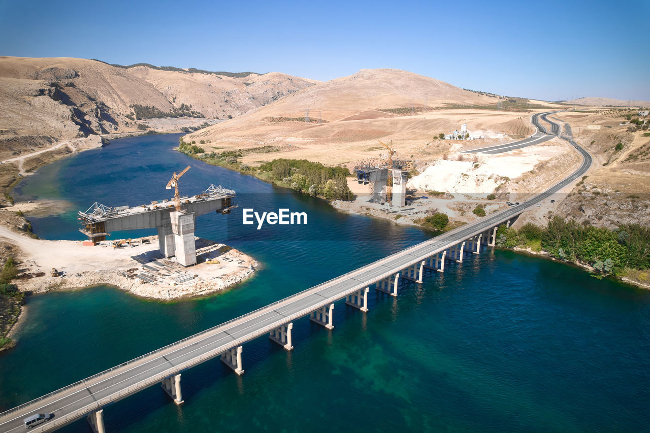 Aerial view of bridge over euphrates river under construction. sanliurfa province, turkey