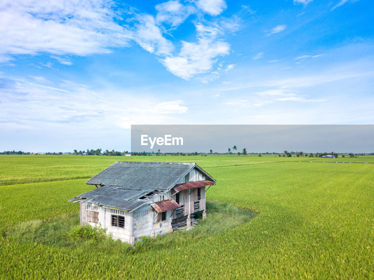 High angle view of house on field against sky