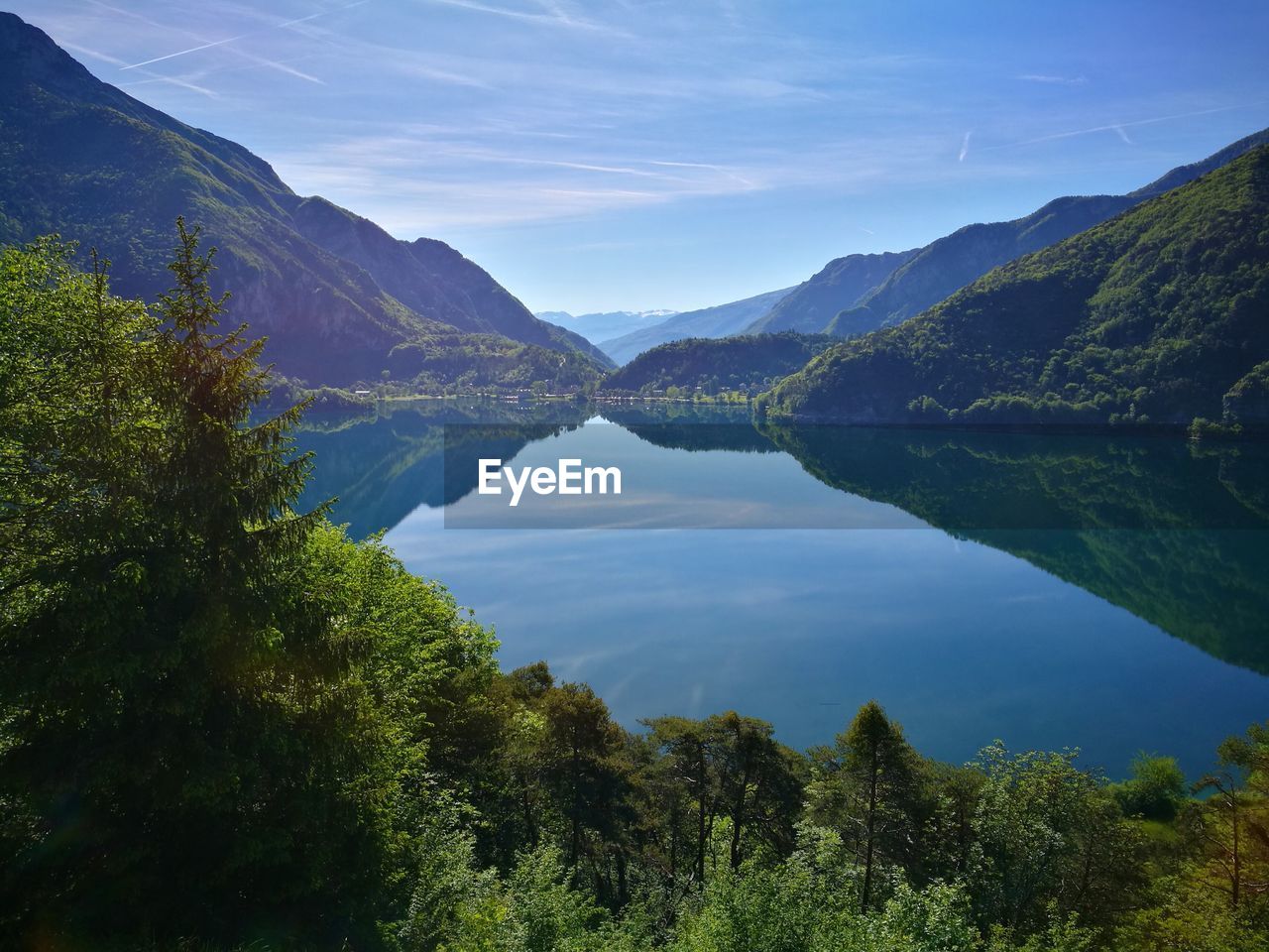 Scenic view of lake and mountains against sky