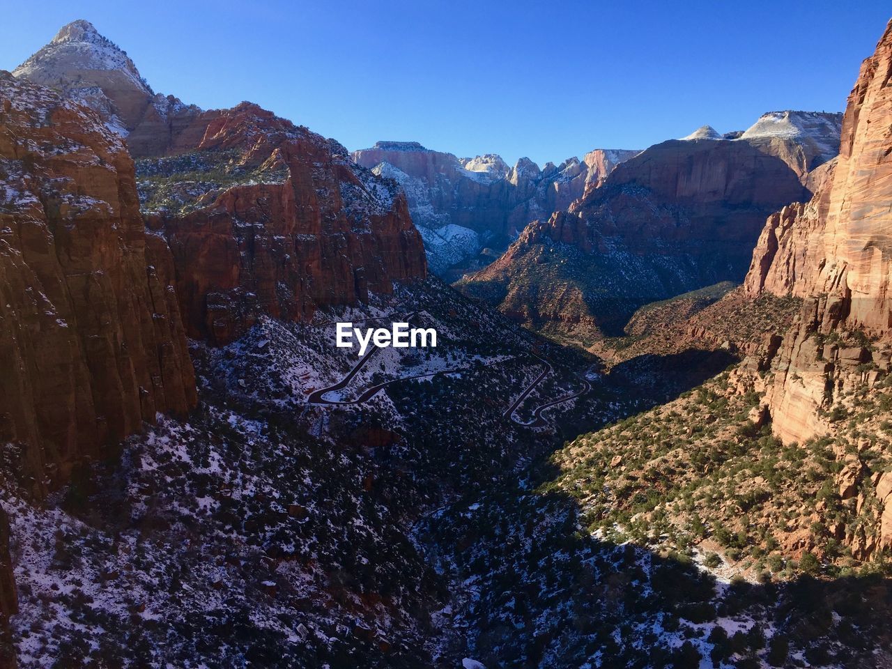 Scenic view of rocky mountains against clear sky at zion national park during winter