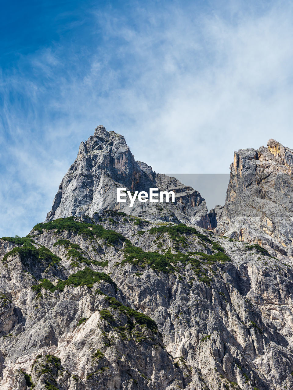 low angle view of rocky mountains against sky