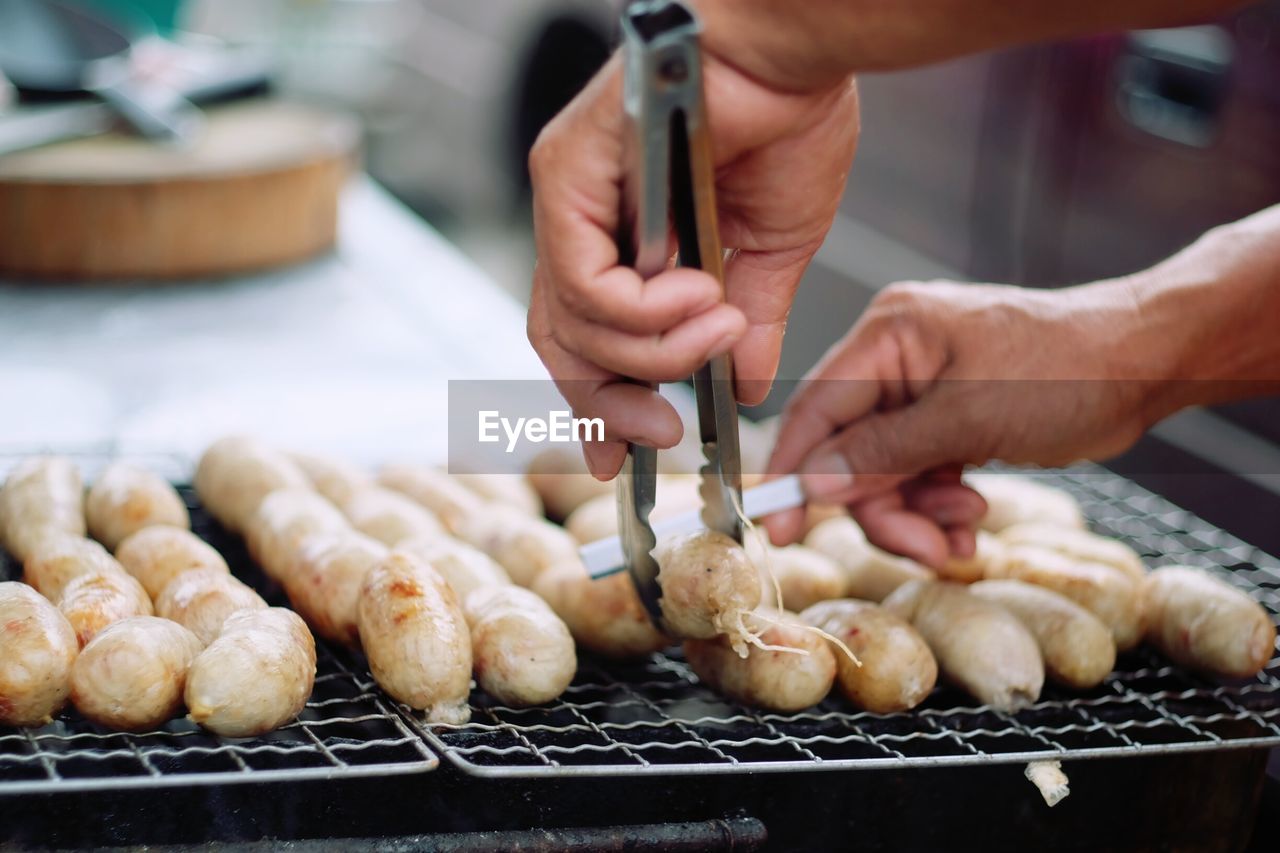 Cropped image of man preparing food