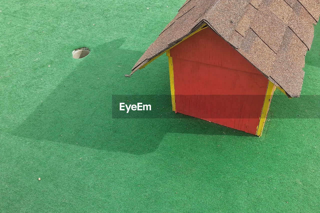 High angle view of playhouse on turf