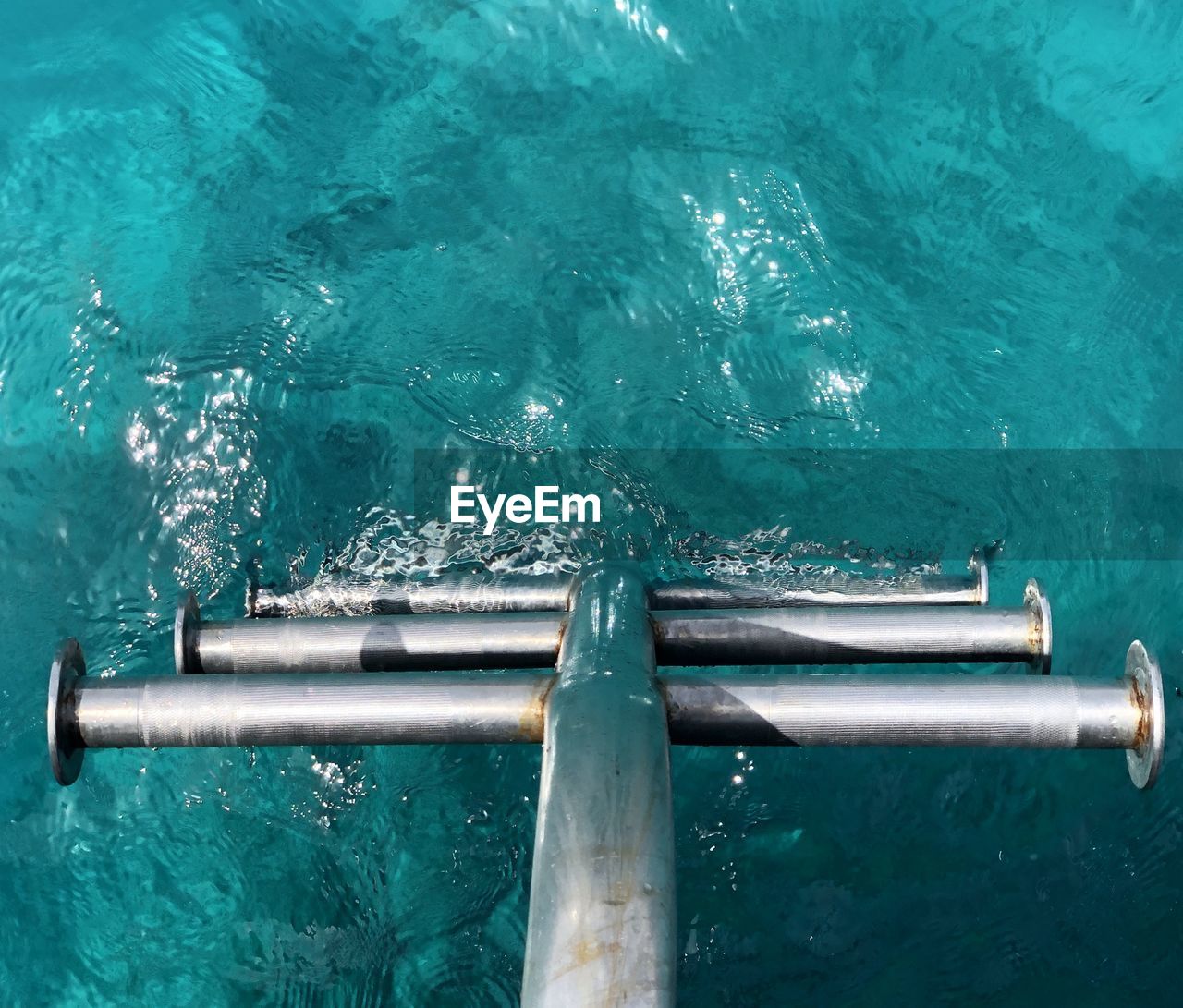 HIGH ANGLE VIEW OF SWIMMING IN POOL