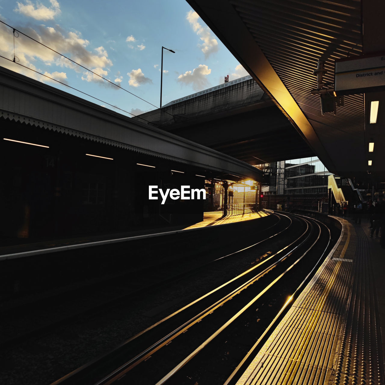 transportation, rail transportation, mode of transportation, track, railroad track, architecture, railroad station, public transportation, railroad station platform, night, train, transport, travel, built structure, motion, city, sky, evening, no people, light, darkness, metropolitan area, illuminated, cloud, train station, public transport, subway train, outdoors, vehicle, station, speed, on the move, nature