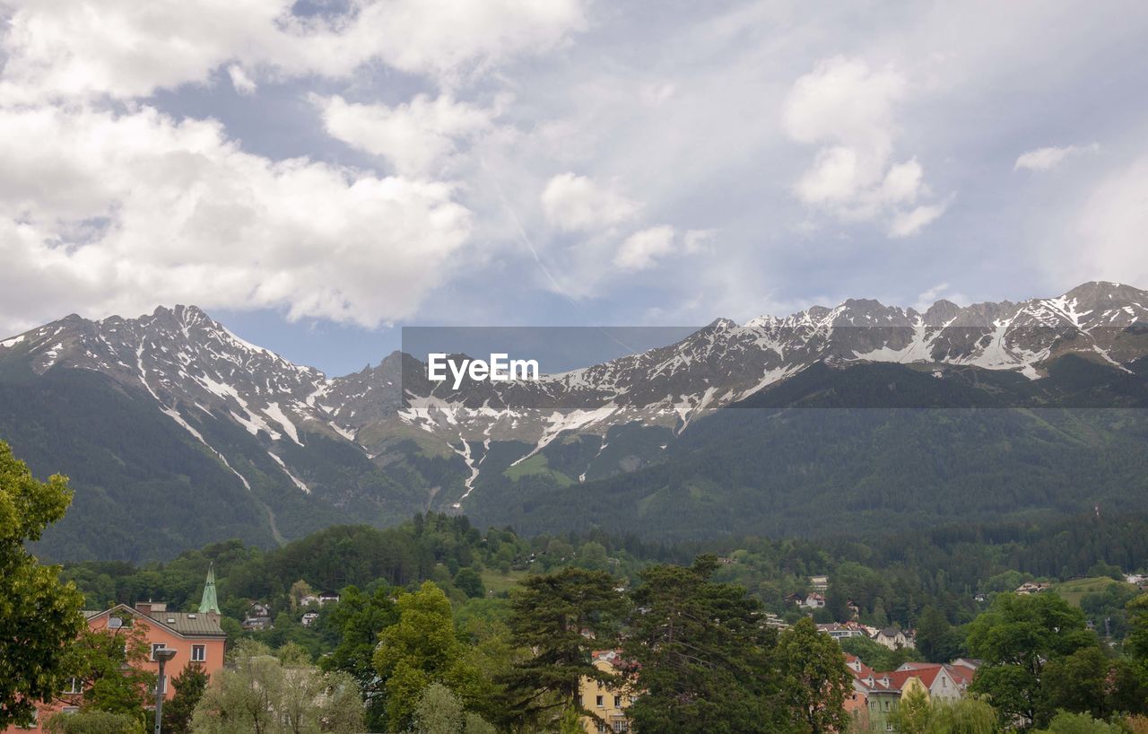 Scenic view of mountains against cloudy sky