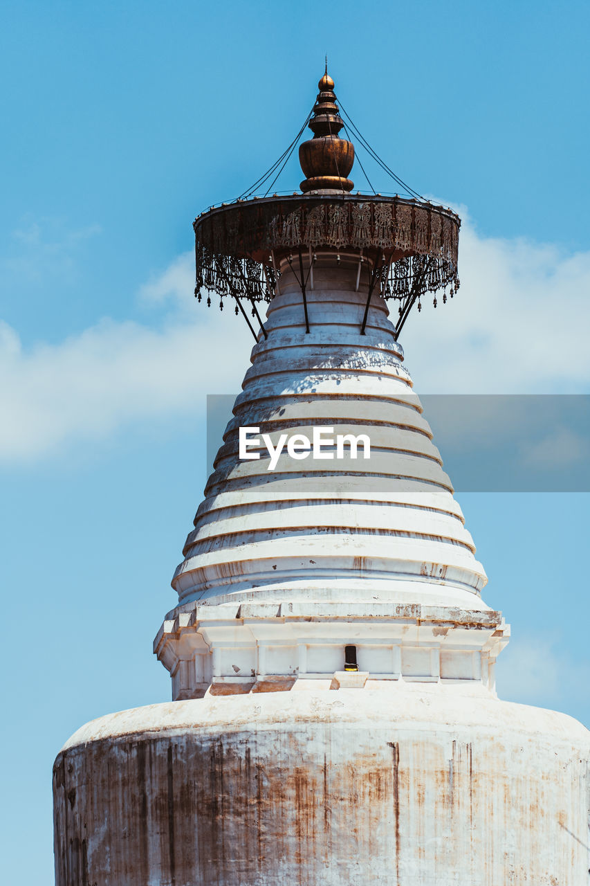 LOW ANGLE VIEW OF BELL TOWER AGAINST BUILDING