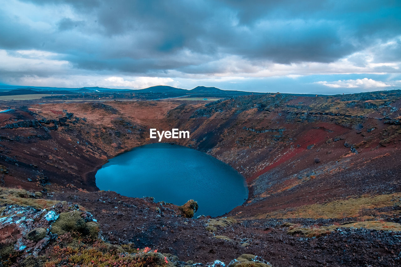 Scenic view of crater lake against sky