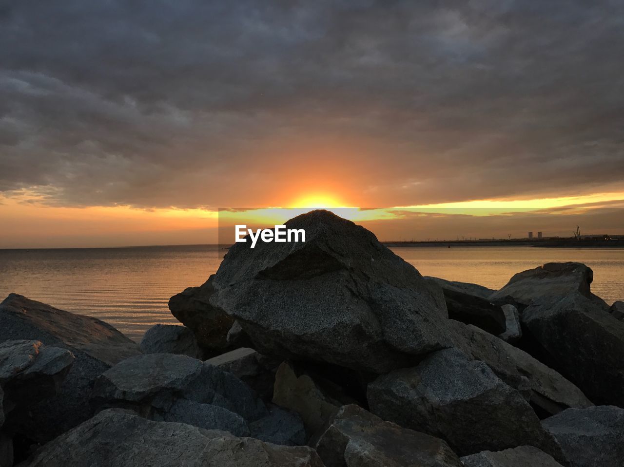 Scenic view of sea against sky at sunset