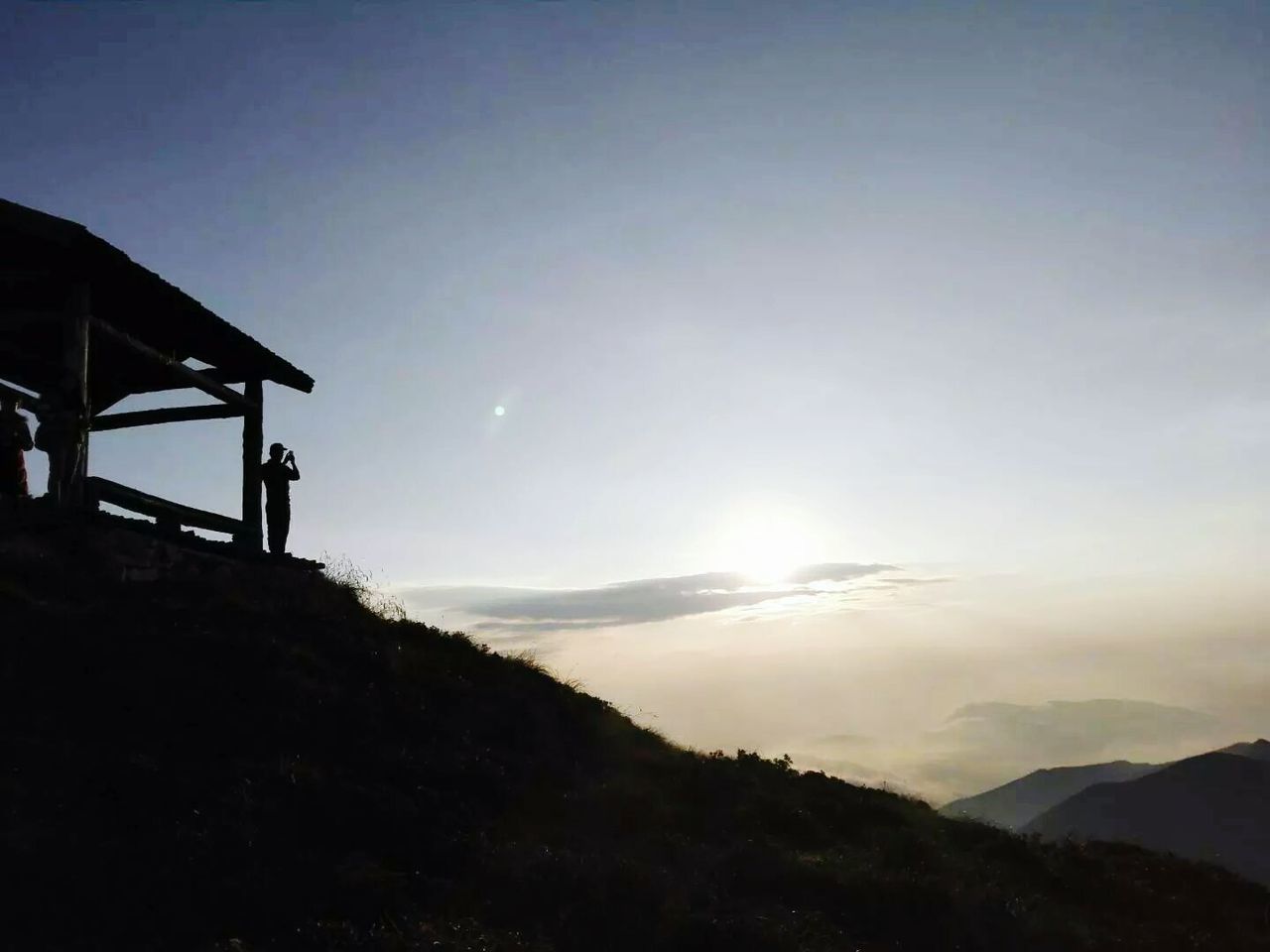 SILHOUETTE MOUNTAIN AGAINST SKY