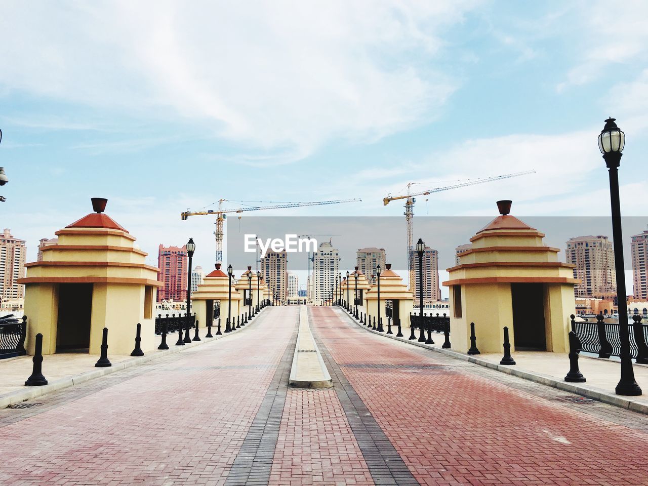 Street amidst buildings against sky