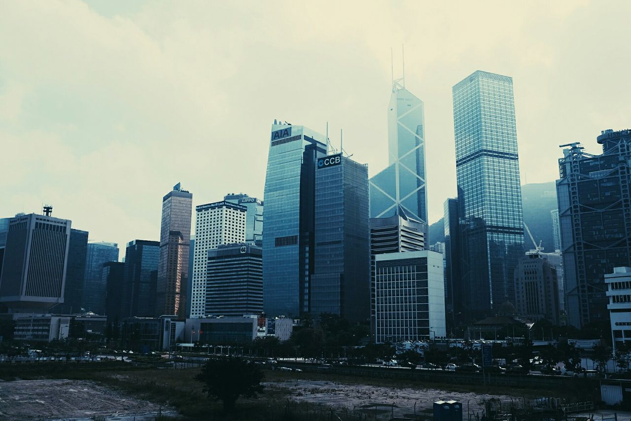 SKYSCRAPERS IN CITY AGAINST SKY