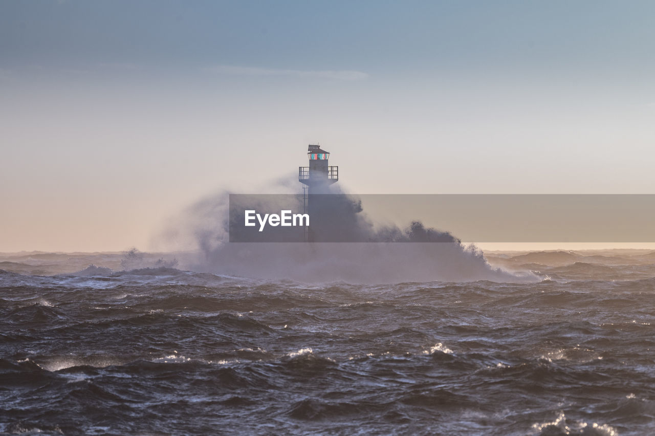 Lighthouse in stormy sea